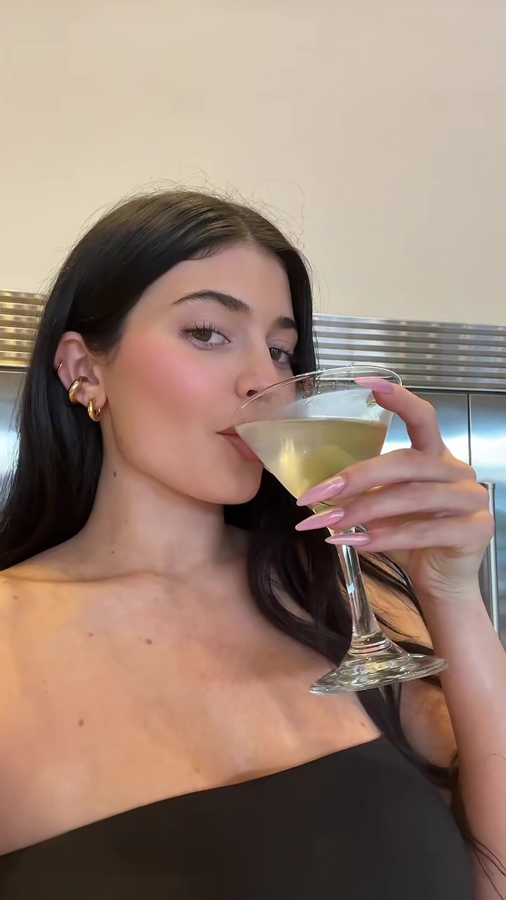 Kylie Jenner shows off her real post-baby body in tight dress as she drinks with mom Kris in new video