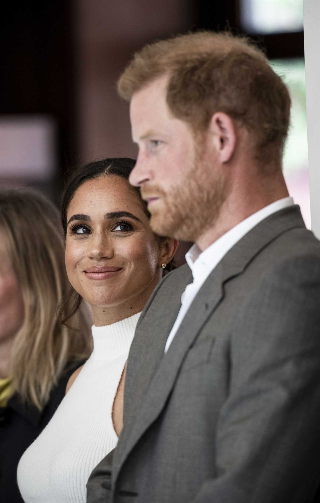 ‘Playful’ Prince Harry ‘has vanished’ as he poses ‘awkwardly’ with Meghan Markle at Invictus Games event