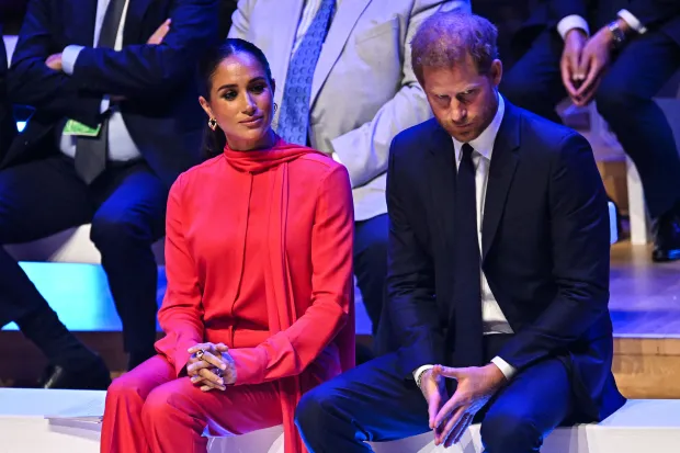 ‘Playful’ Prince Harry ‘has vanished’ as he poses ‘awkwardly’ with Meghan Markle at Invictus Games event