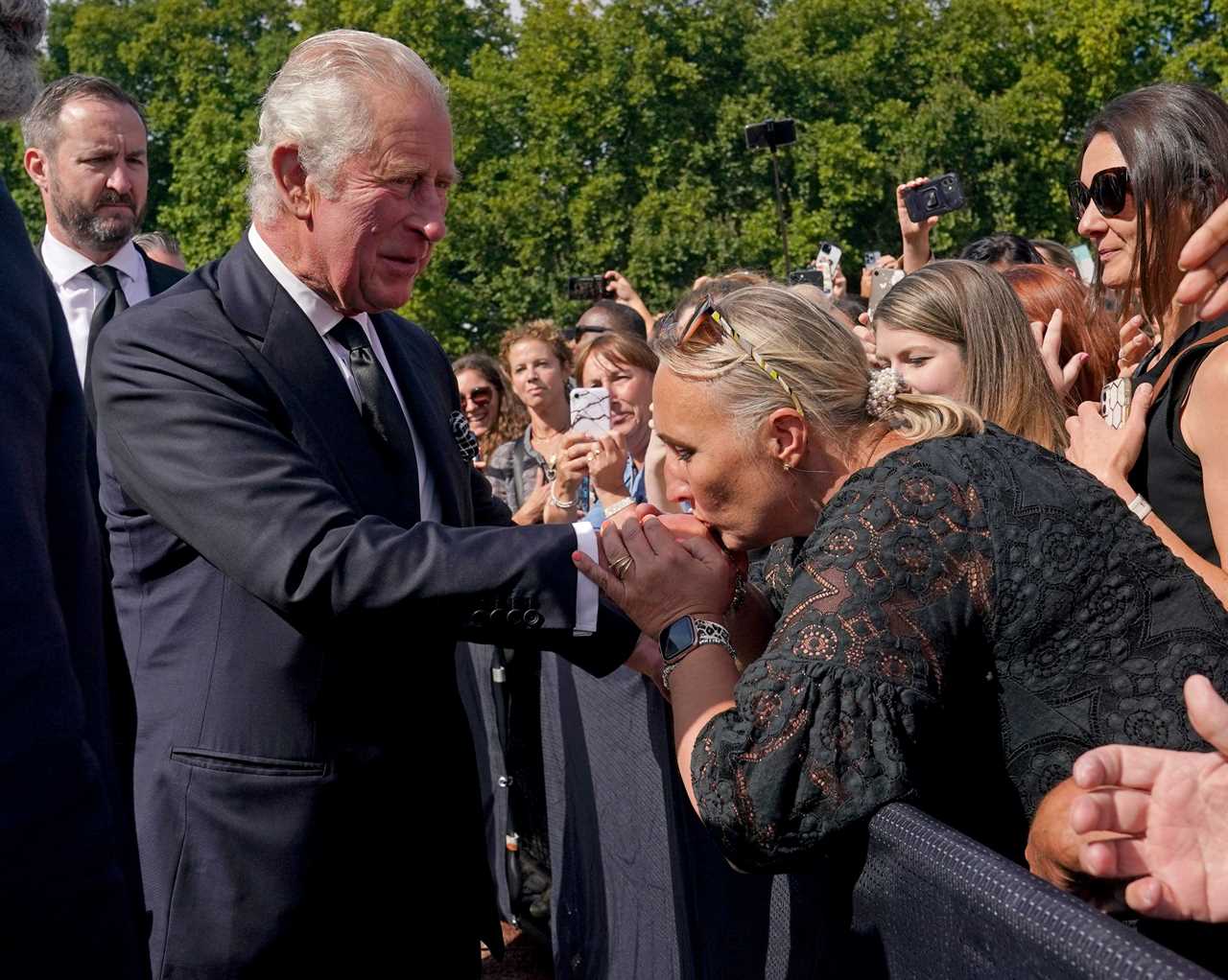 ‘Vulnerable’ King Charles ‘overwhelmed by grief’ as he looks at tributes to the Queen, body language expert claims