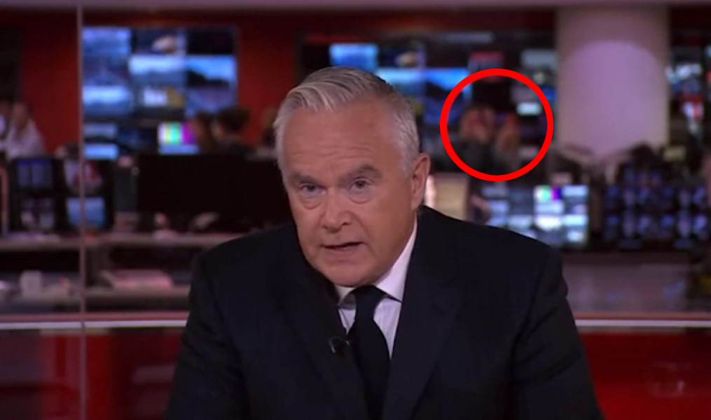 Watch shock moment BBC staffers take PHOTOS in background of Queen’s death announcement by emotional Huw Edwards