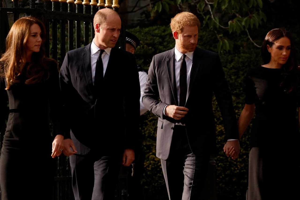 Sweet moment Meghan Markle comforts Prince Harry as he looks at floral tributes for the Queen