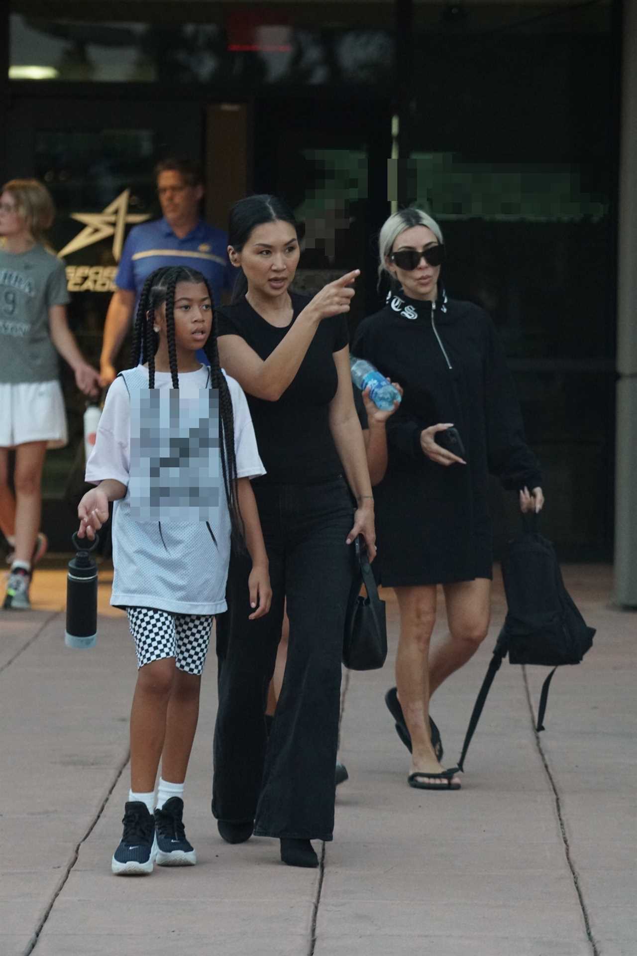 Kim Kardashian proudly shows off her hair’s natural roots and psoriasis scars during casual outing with North, 9, & pals