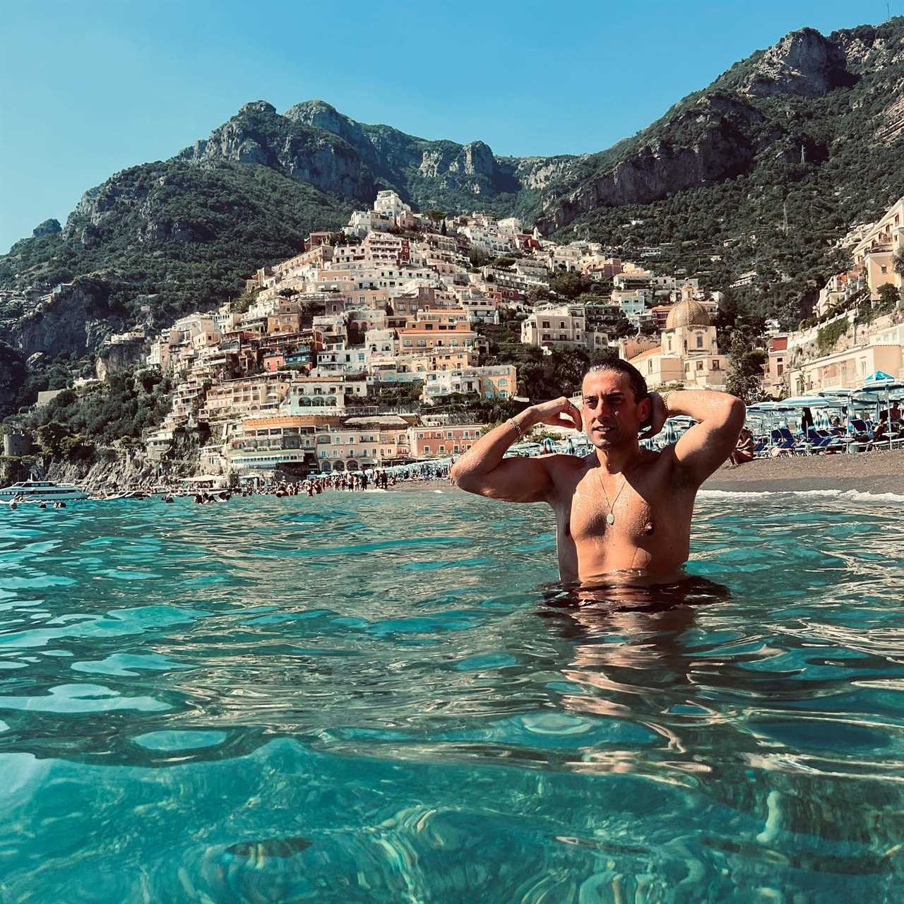 James Argent looks slimmer than ever as he poses topless while swimming in Italy