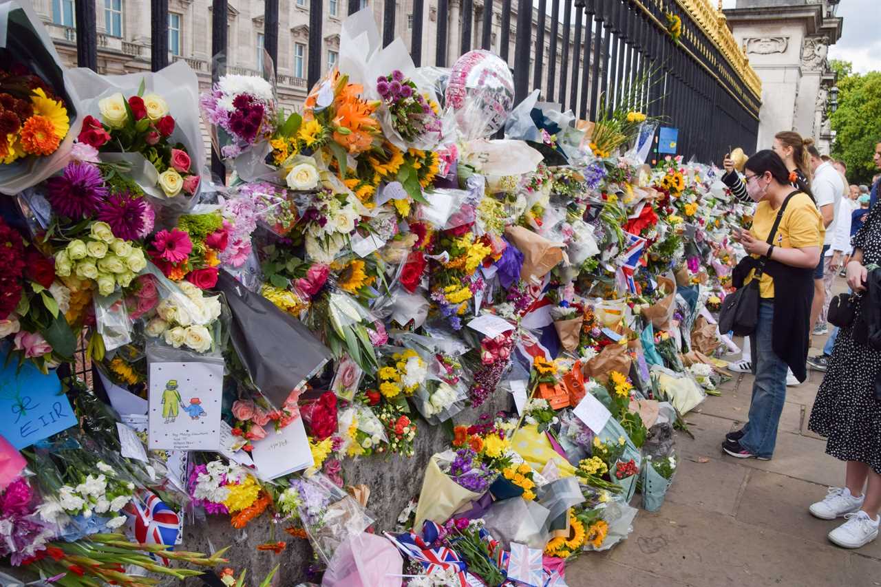 The ocean of flowers ­outside the palaces is the true measure of the Queen’s worldwide fame