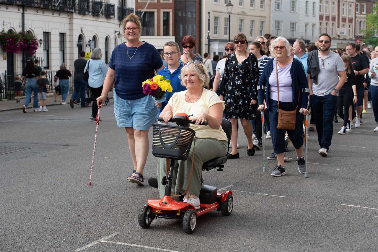 Thousands camp out in Windsor to see the Queen’s final journey, with blitz spirit Brits sharing marmalade sandwiches