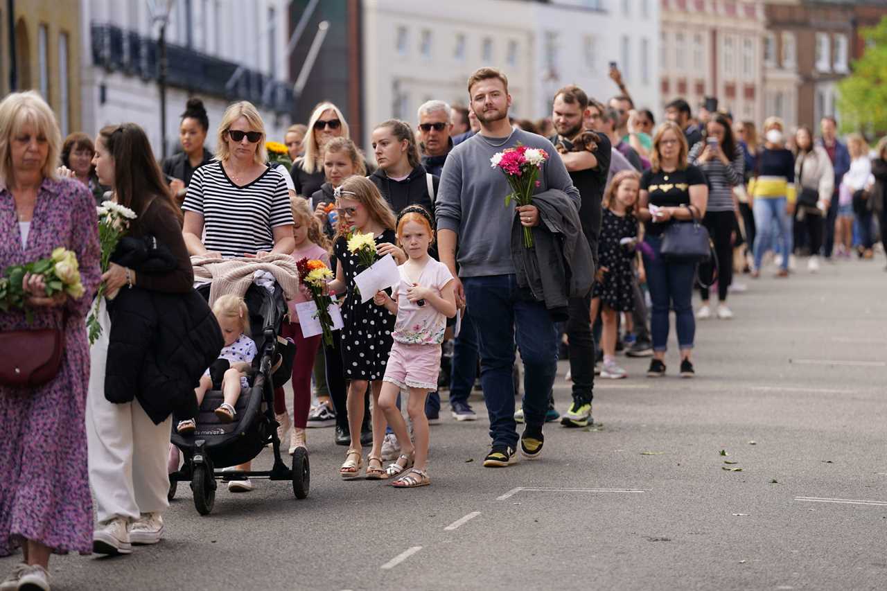 Thousands camp out in Windsor to see the Queen’s final journey, with blitz spirit Brits sharing marmalade sandwiches