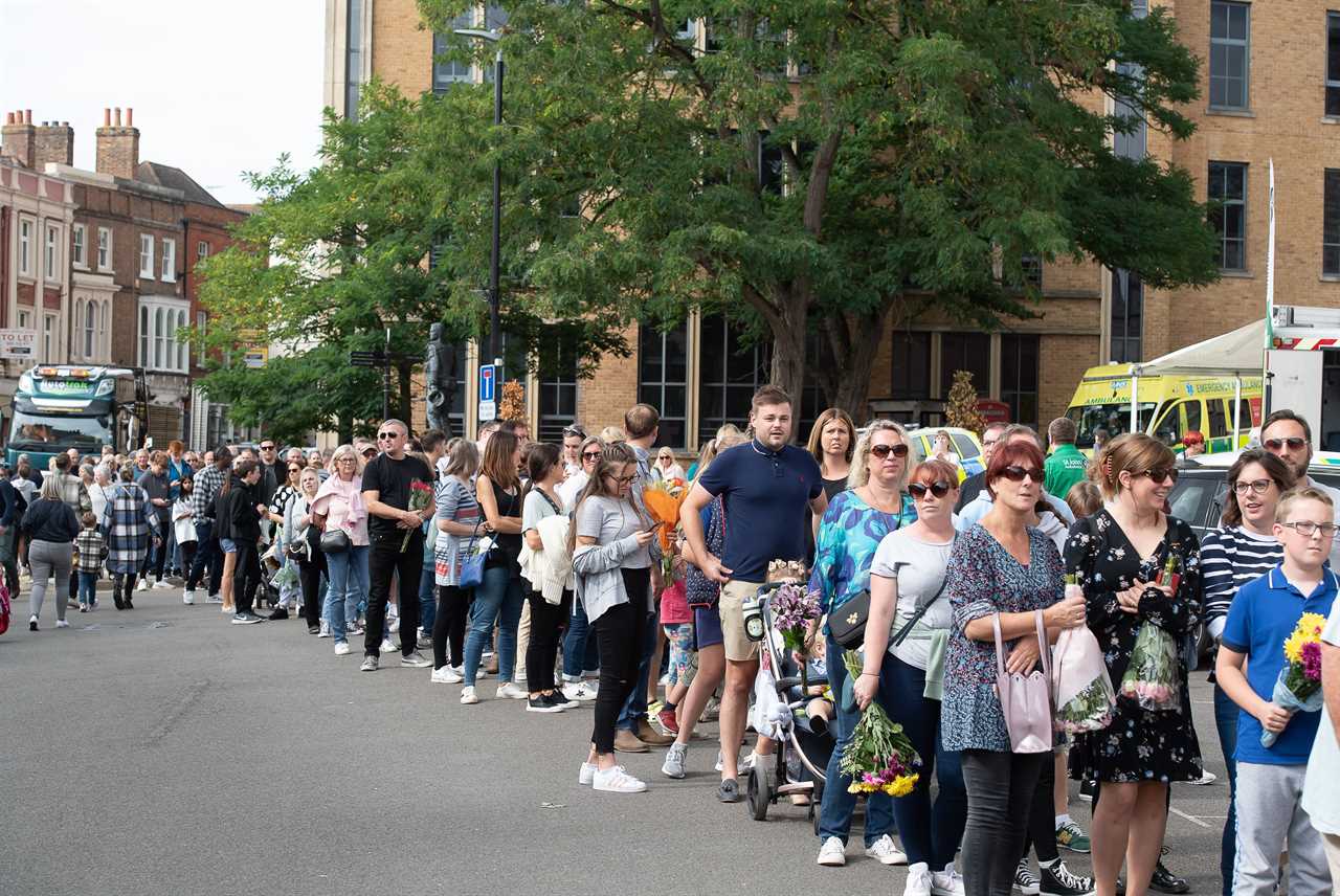 Thousands camp out in Windsor to see the Queen’s final journey, with blitz spirit Brits sharing marmalade sandwiches