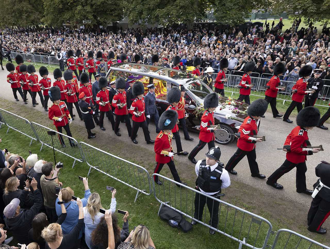 Moving moment a vast and silent crowd welcomed the Queen home for final time