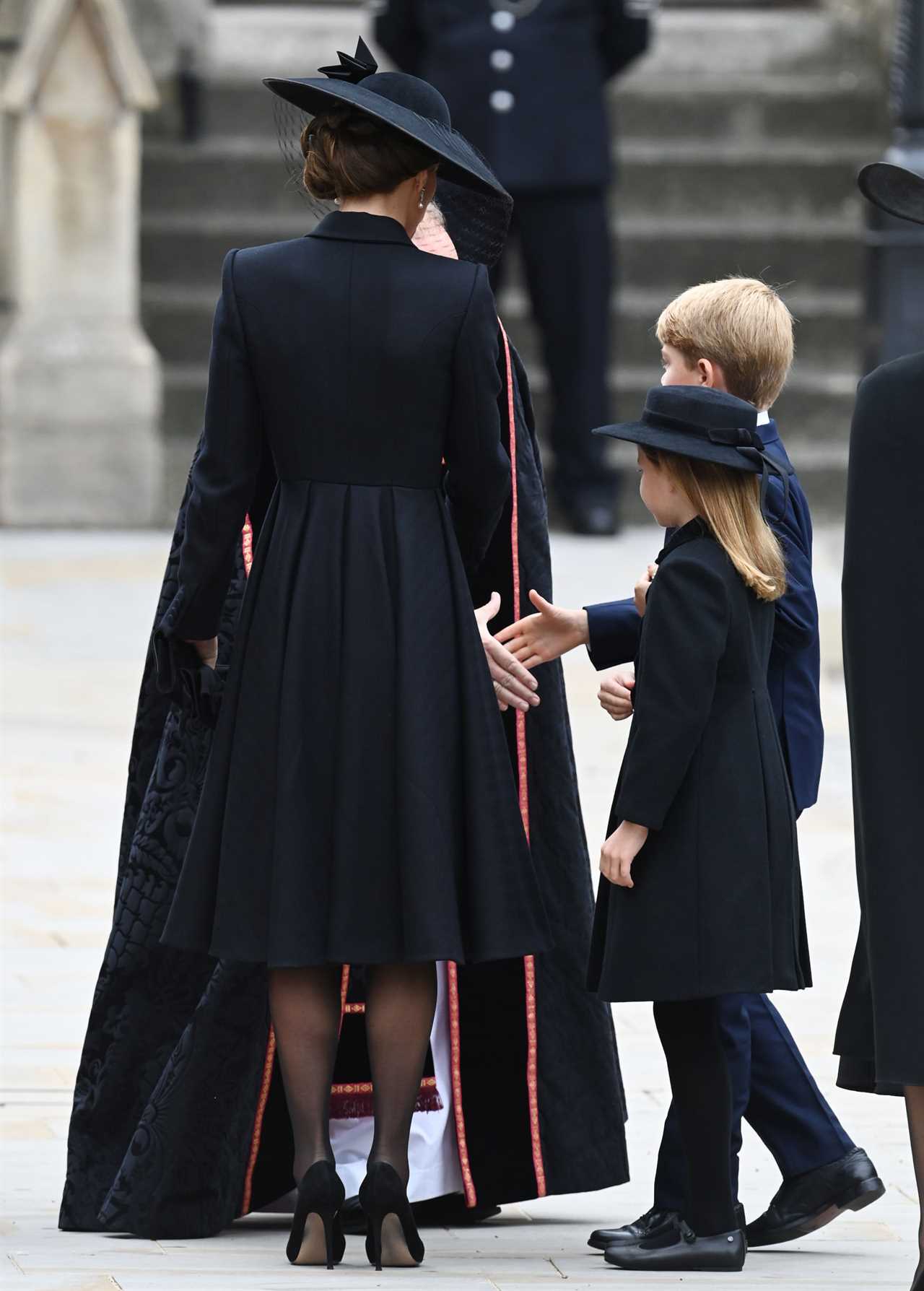 Prince George, 9, and Princess Charlotte, 7, walk beside William and Kate as they enter Abbey for Queen’s funeral