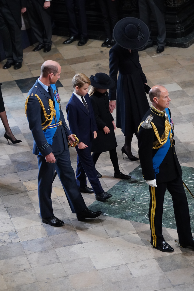 Cheeky Prince George spotted poking out his tongue as he sits next to Charlotte after Queen’s funeral procession