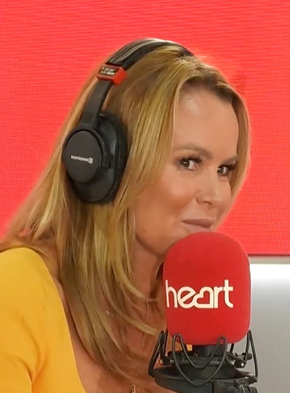 Amanda Holden gleefully takes a swipe at Phillip Schofield ‘jumping the Queen’s queue’ after their bitter feud