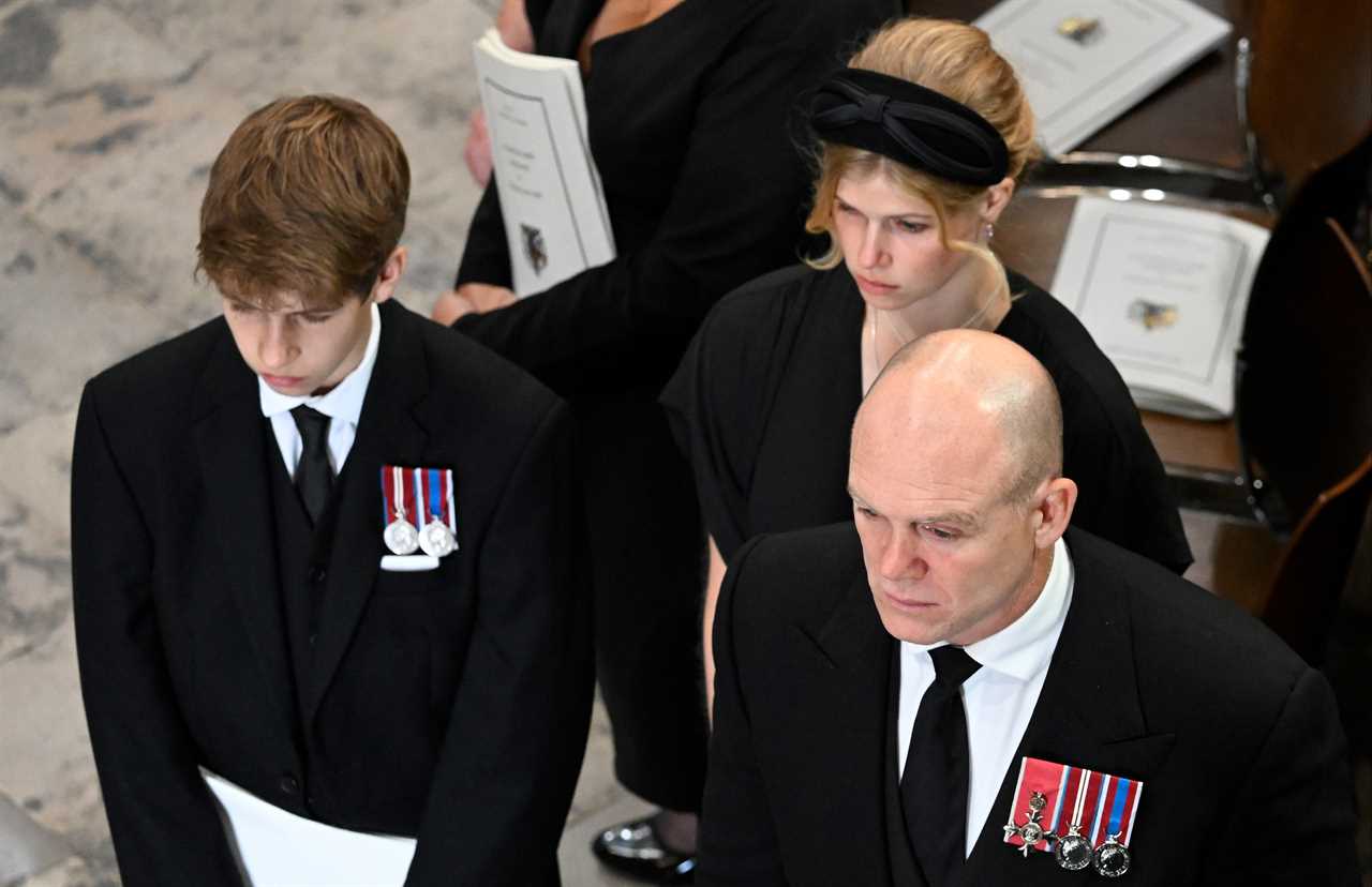 Touching moment Queen’s youngest grandson James, 14, is comforted by cousin-in-law Mike Tindall at Queen’s funeral