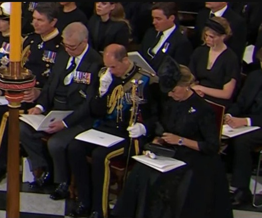 Touching moment Queen’s youngest grandson James, 14, is comforted by cousin-in-law Mike Tindall at Queen’s funeral