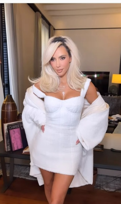 Kim Kardashian shows off her tiny waist in a tight white dress during Fashion Week in Milan after major weight loss
