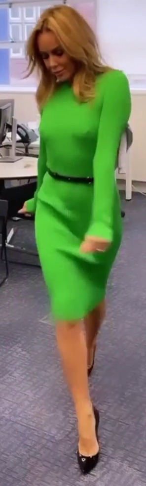 Amanda Holden goes braless in skintight green dress as she struts through Heart Radio office