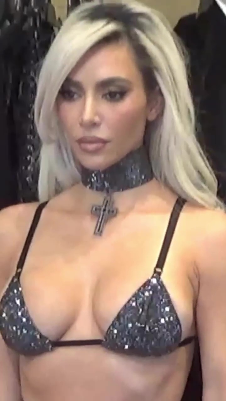 Kim Kardashian nearly busts out of tiny bra & flaunts giant choker in new video at Dolce & Gabbana show