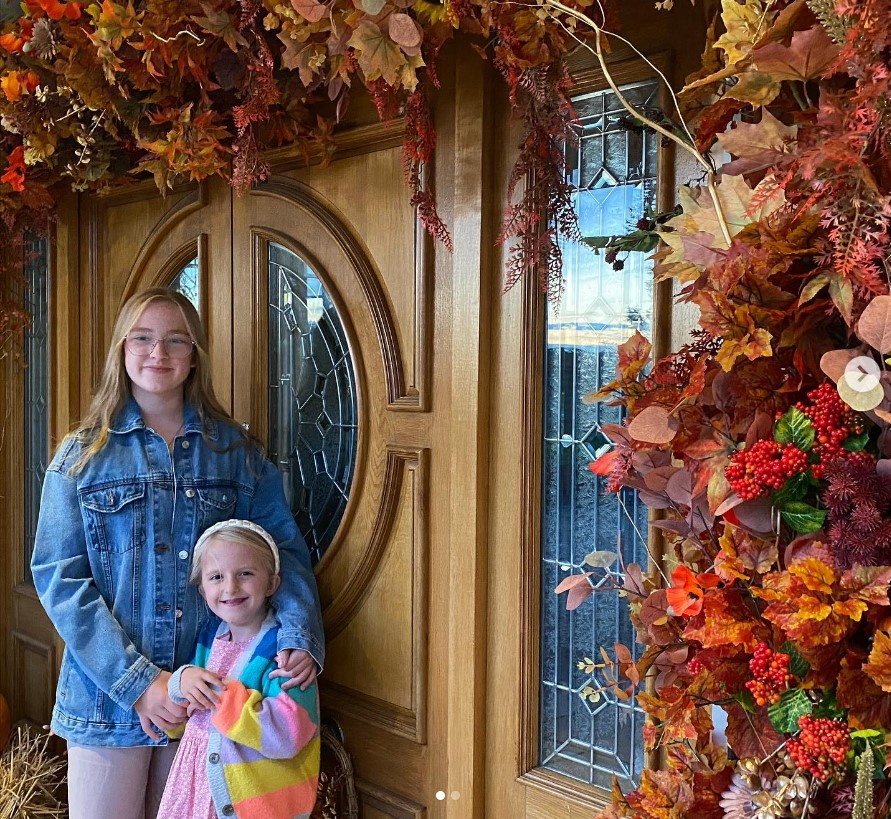 EastEnders star Natalie Cassidy shares sweet snap of rarely-seen daughters posing outside her autumnal front door