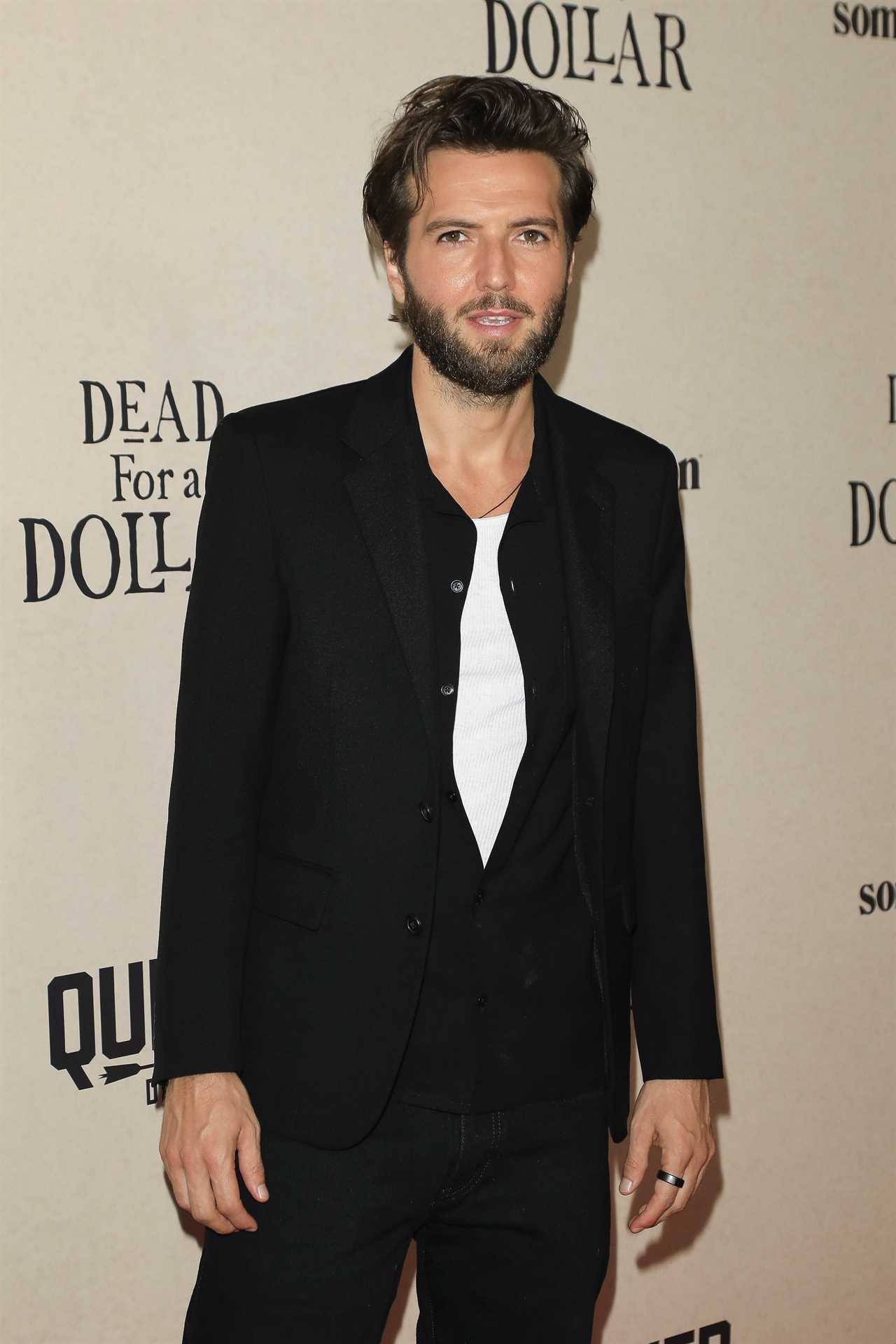 Hollyoaks star Guy Burnet unrecognisable 14 years after shock exit as he walks the red carpet at Hollywood movie