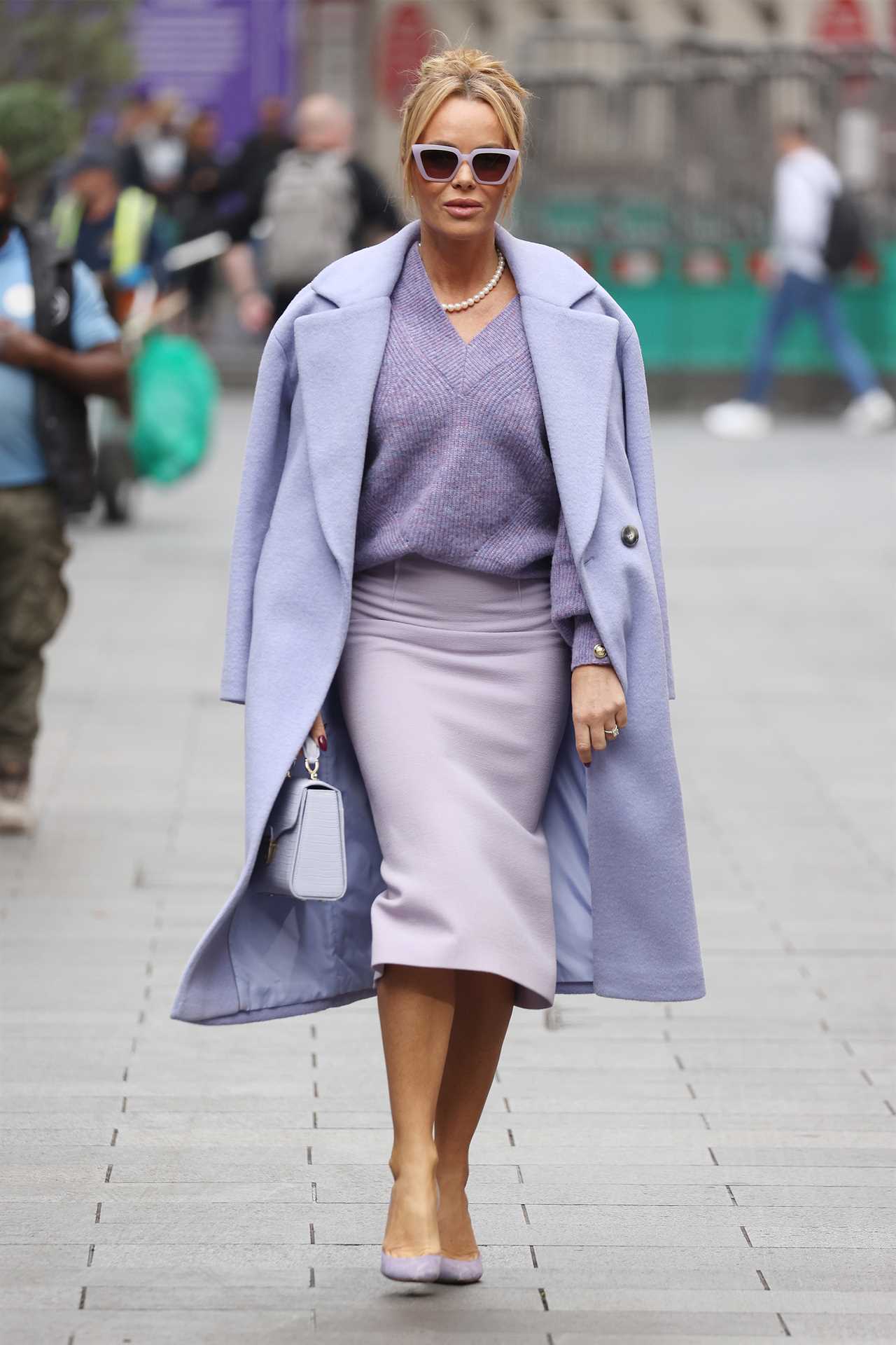 Amanda Holden goes braless in chic lilac outfit as she leaves work in London