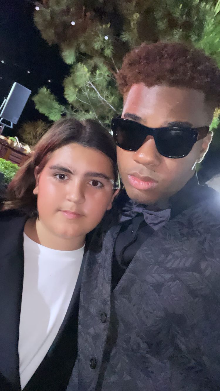 The pre-teen surfaced in photos from Kourtney and Travis' wedding reception in Italy, after fans feared he missed the big event