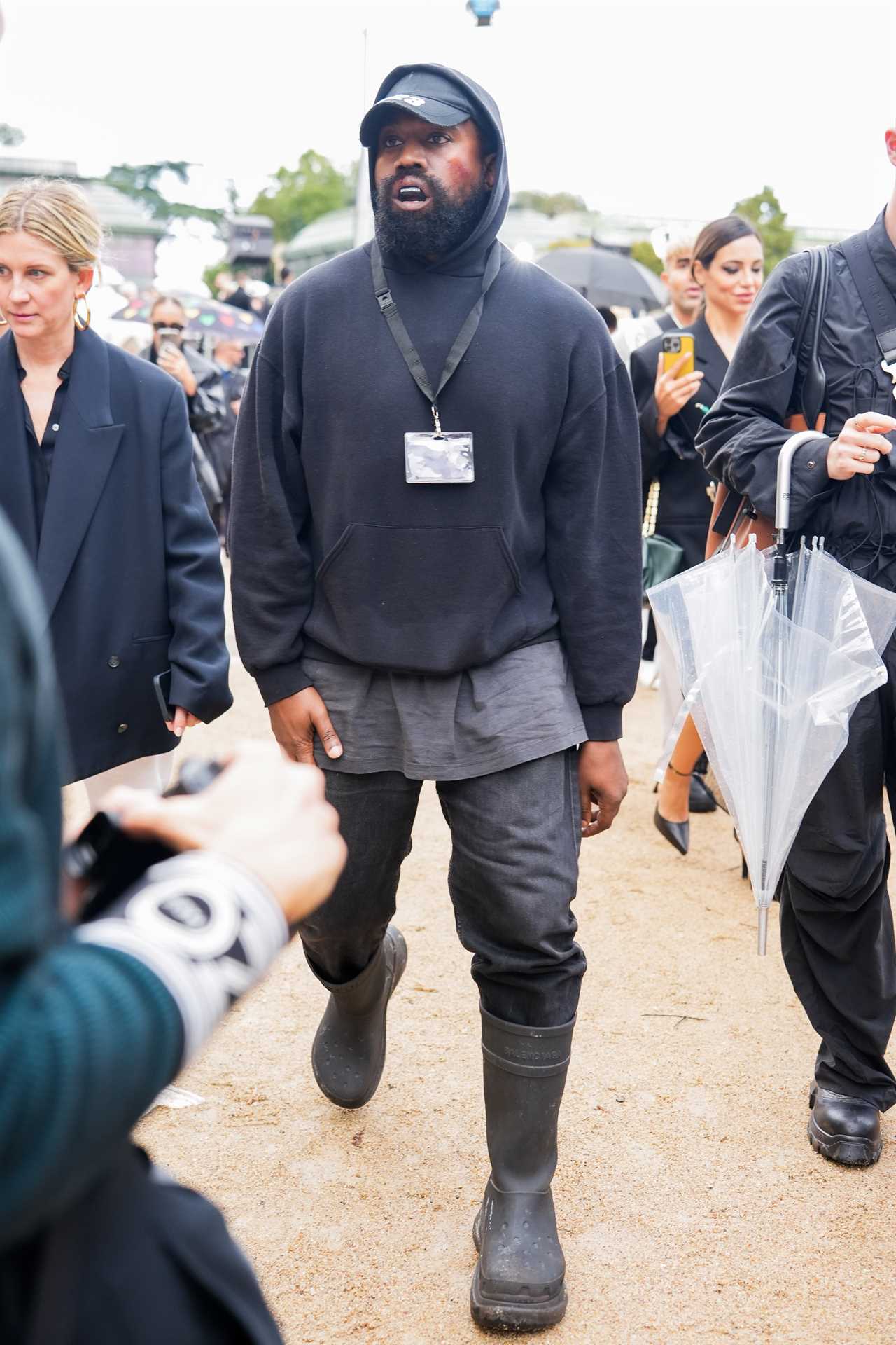 Fans concerned for Kanye West after he shows off ‘bloody lip & bruised face’ at Paris Fashion Week