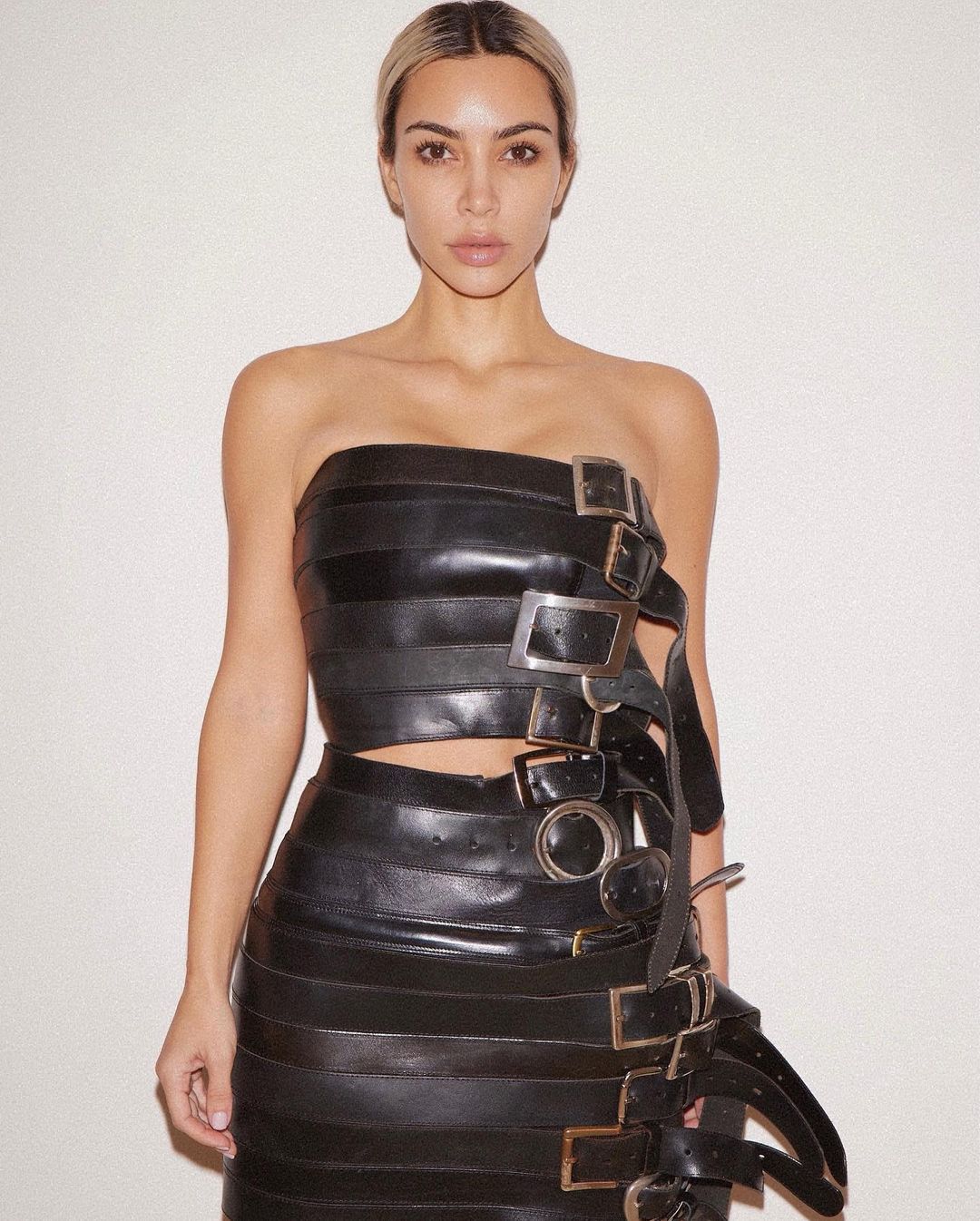 Kim Kardashian shows off real skin without makeup while posing in her most bizarre outfit yet