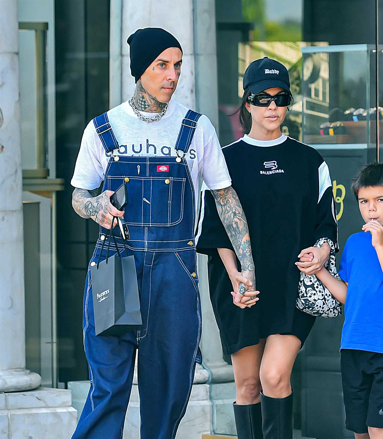 Kourtney Kardashian drowns her frame in baggy T-shirt on day out with Travis Barker and Reign, 7, amid pregnancy rumors