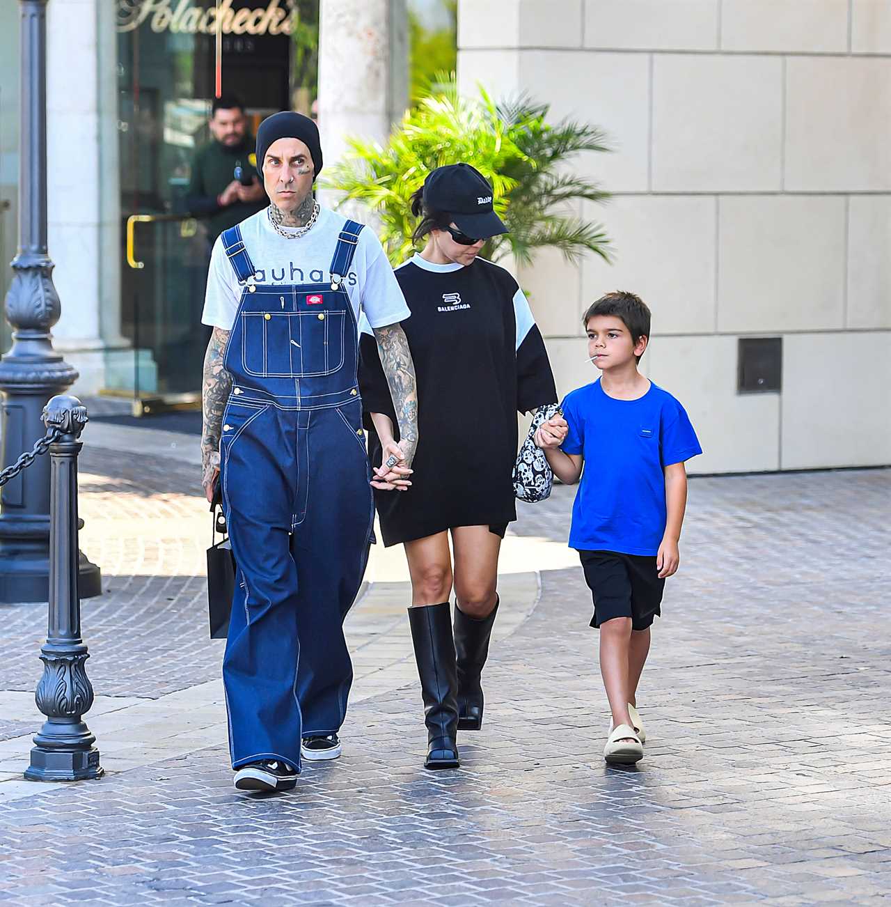 Kourtney Kardashian drowns her frame in baggy T-shirt on day out with Travis Barker and Reign, 7, amid pregnancy rumors