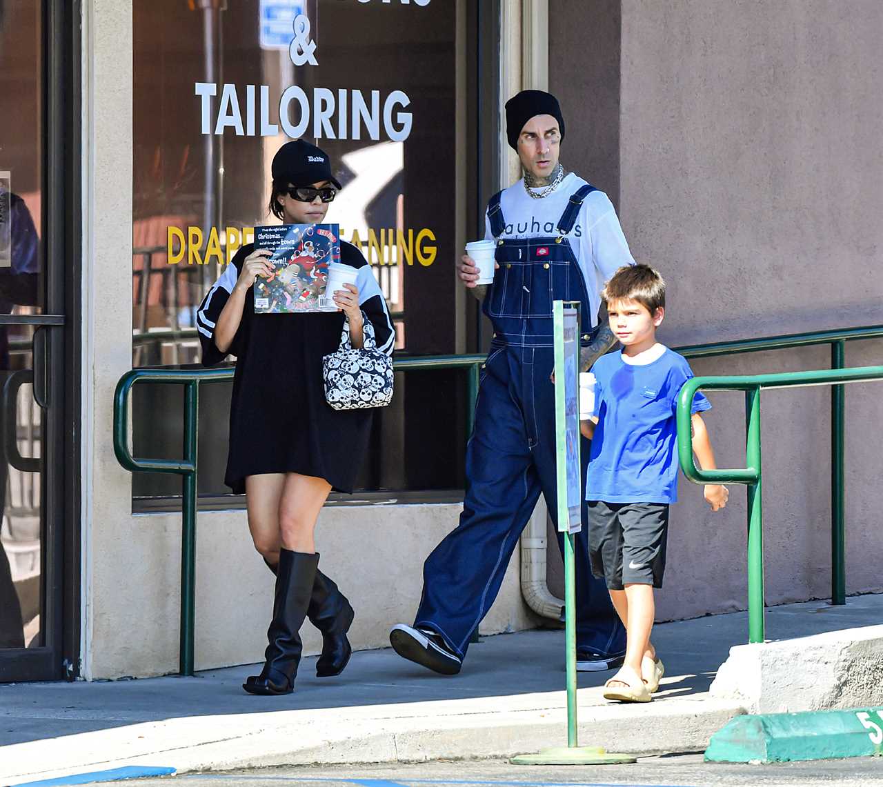 Kourtney Kardashian drowns her frame in baggy T-shirt on day out with Travis Barker and Reign, 7, amid pregnancy rumors