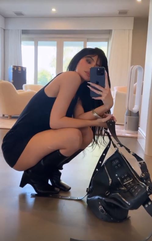 Kylie Jenner’s bare butt pops out of super short black minidress as she shows off sexy pose in NSFW wardrobe malfunction