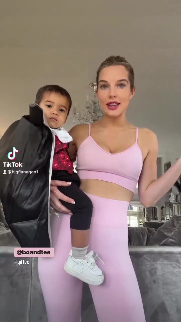 Newly-single Helen Flanagan shows off her abs in a crop top and leggings in sweet Halloween video with her kids