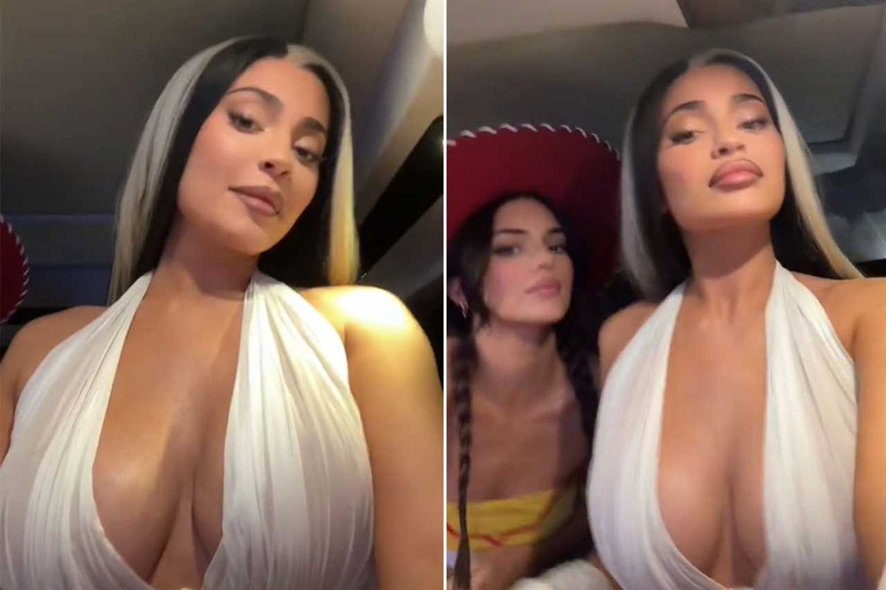 Kylie Jenner almost busts out of plunging tight dress as star channels Elvira in raunchiest Halloween video yet