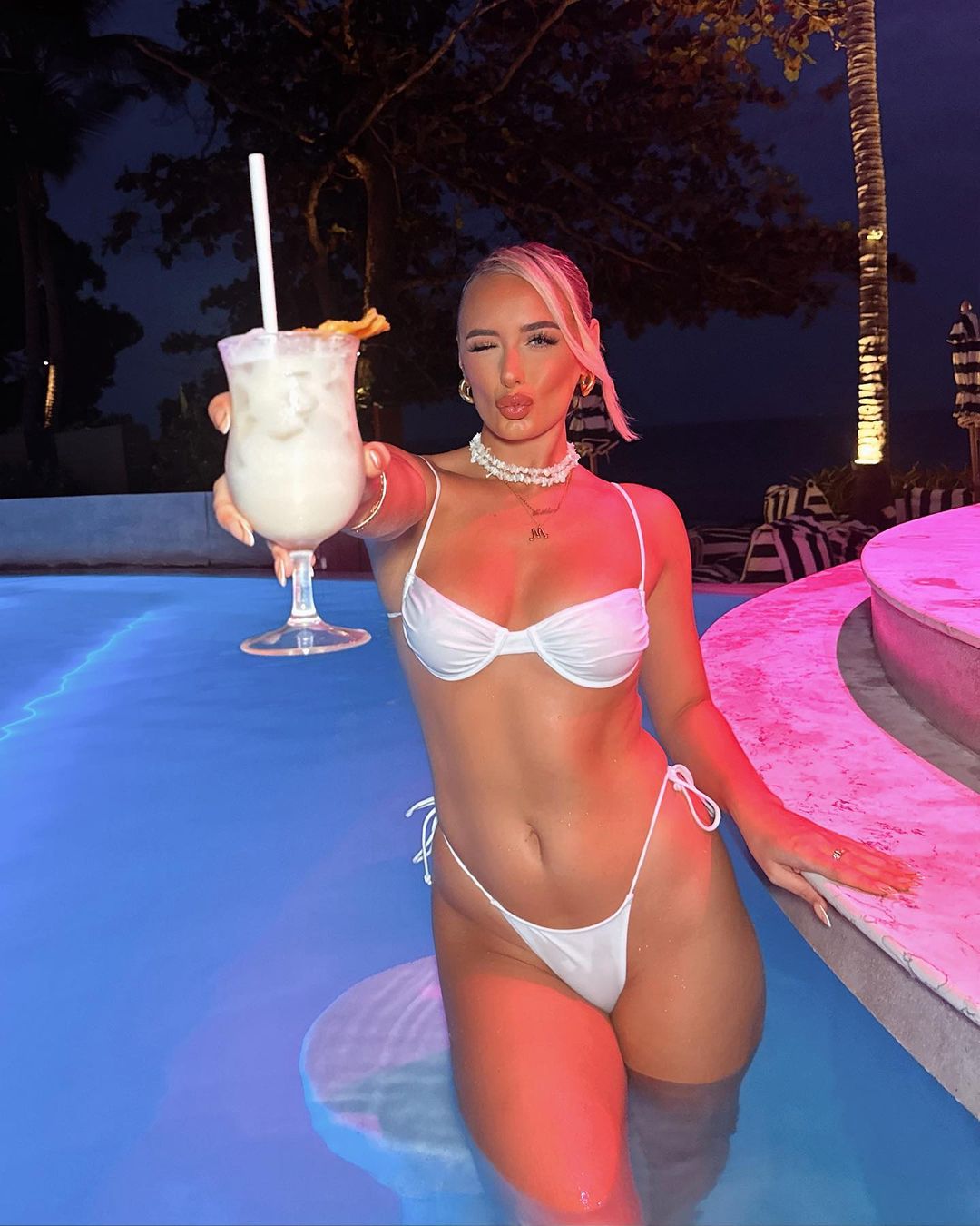Love Island star poses for sexiest shots ever in bikini that would be too skimpy for the villa