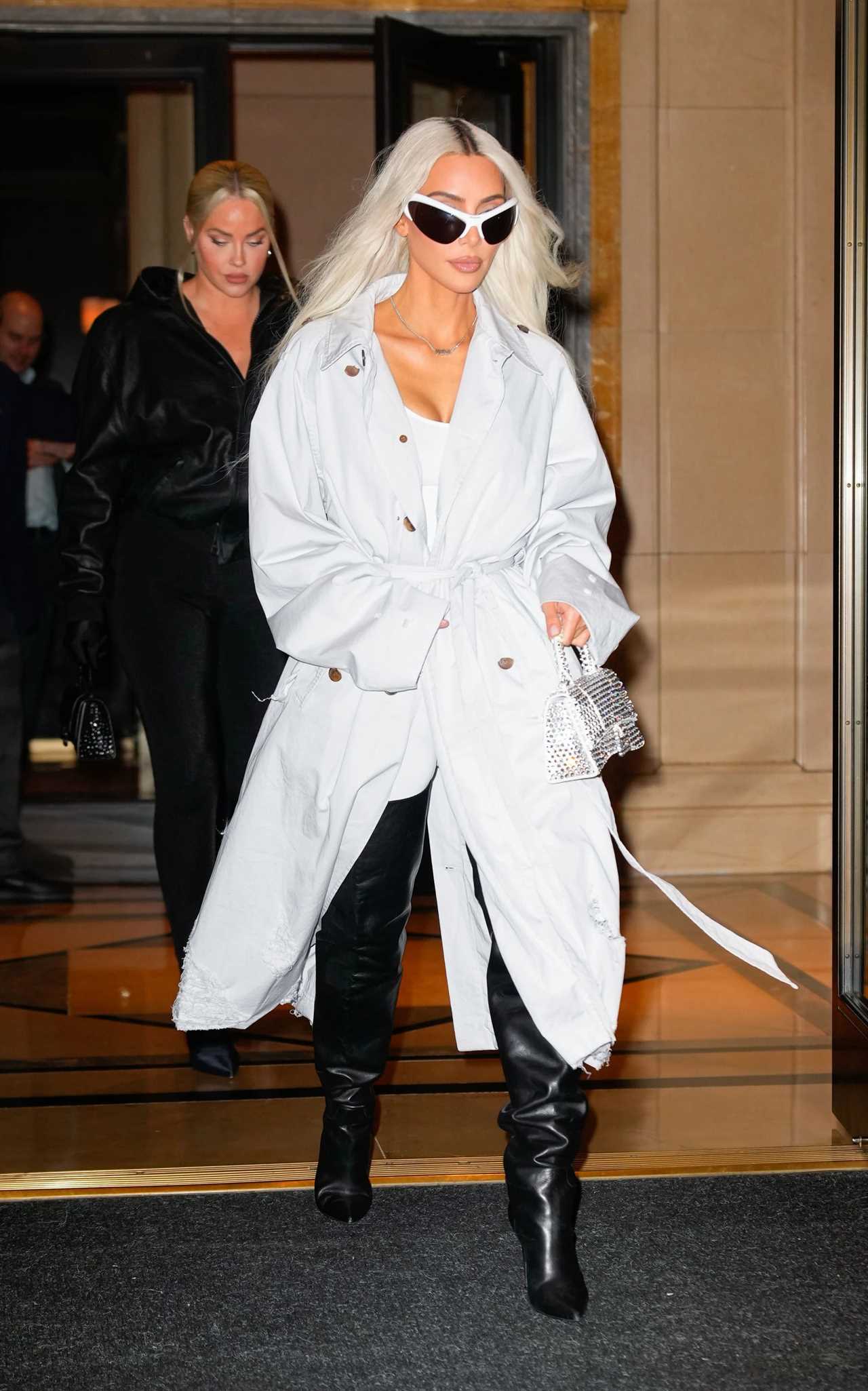 Kim Kardashian’s frail frame drowns in baggy trench coat in new photos after fans fear star took weight loss ‘too far