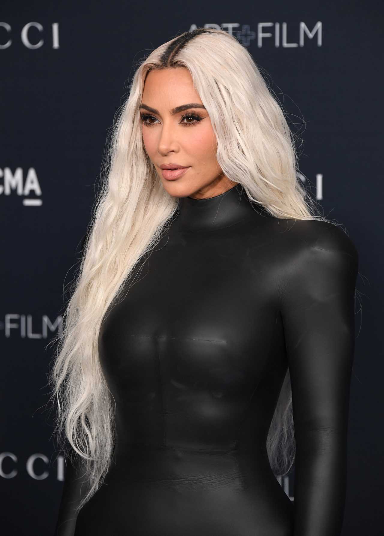 Kim Kardashian shows off her real skin in new unedited photos but fans are shocked by ‘odd’ detail on her neck