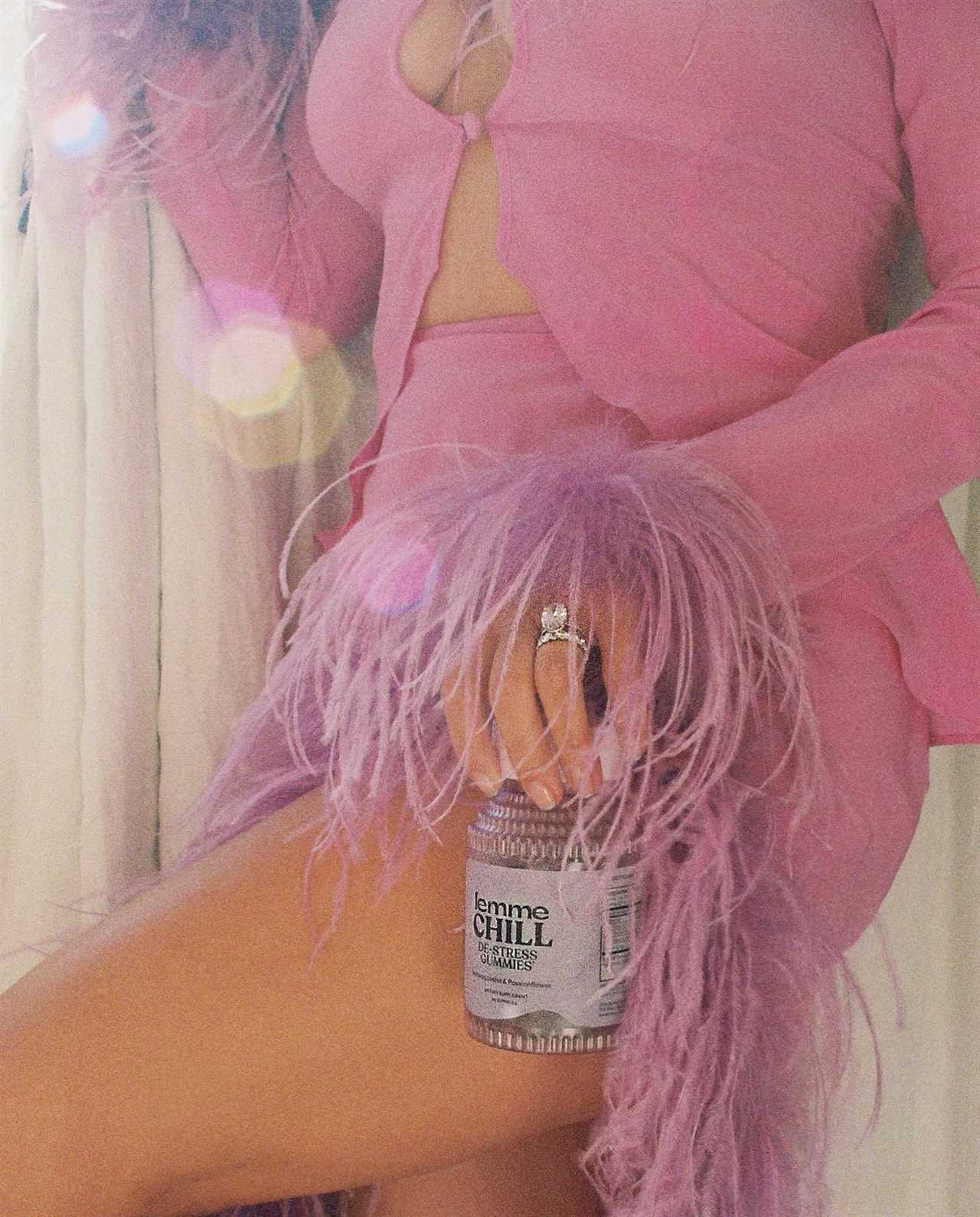 Kourtney Kardashian covers tummy with feathers for new Lemme ad as fans think star is pregnant with Travis Barker’s baby