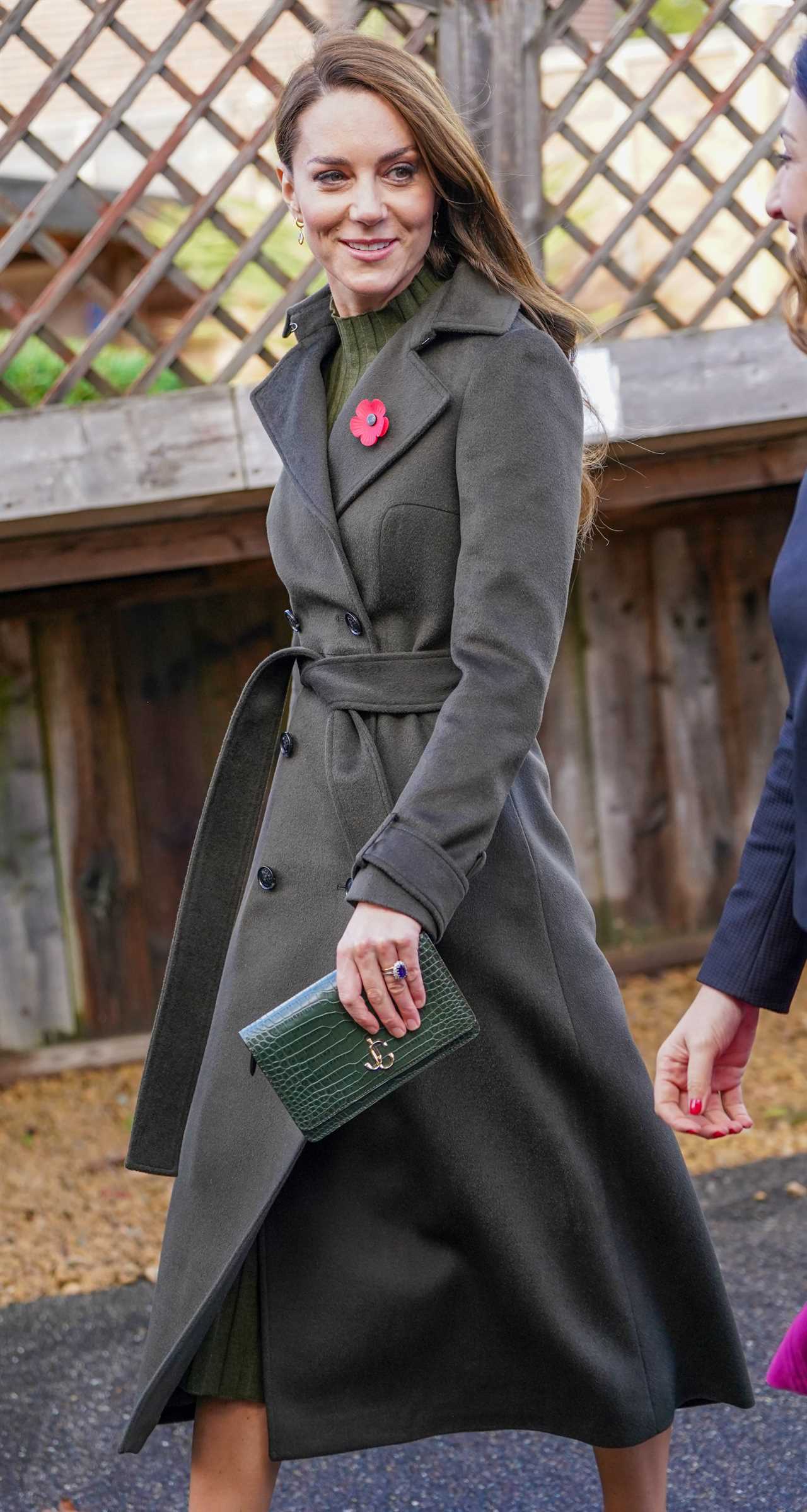 Princess of Wales hands her poppy to a 3-year-old boy on visit to children’s centre in London