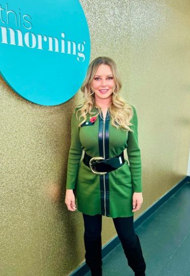 Carol Vorderman looks incredible as she shows off curves in tight green jumper