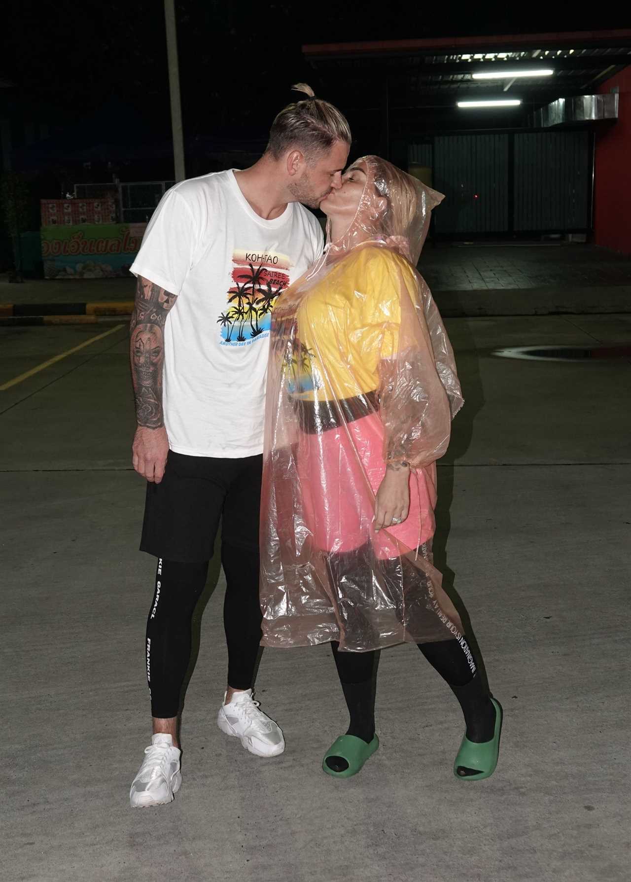 Katie Price baffles fans as she wears giant see-through raincoat in Thailand after ’16th boob job’