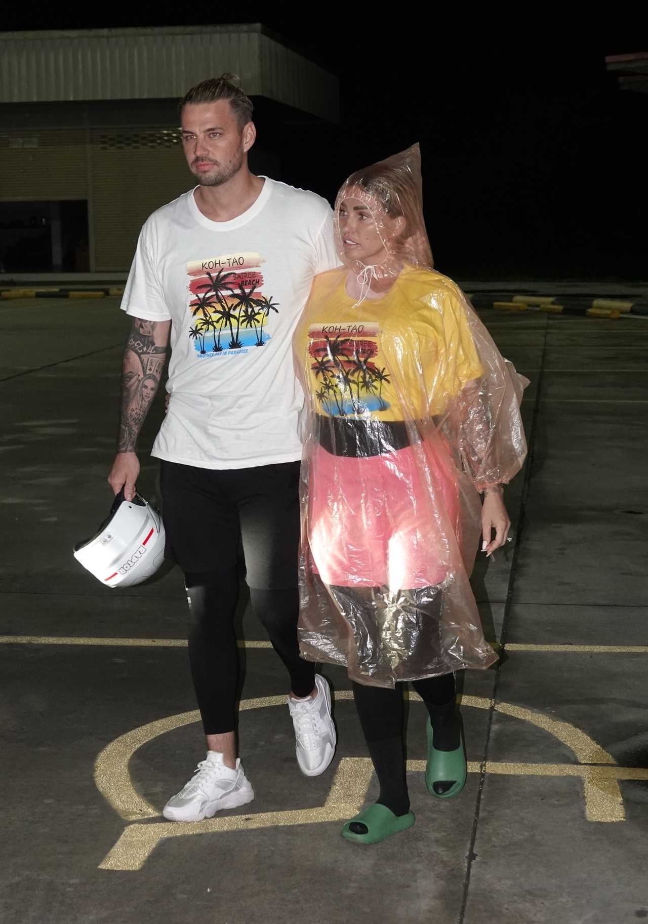 Katie Price baffles fans as she wears giant see-through raincoat in Thailand after ’16th boob job’