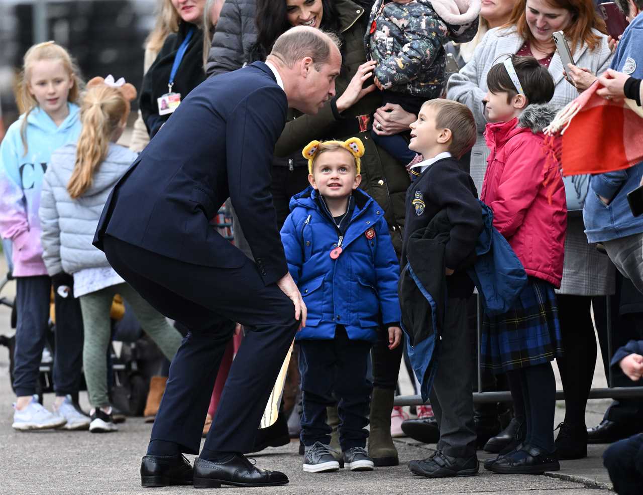 Prince of Wales hugs little boy and vows to put his picture on the royal fridge