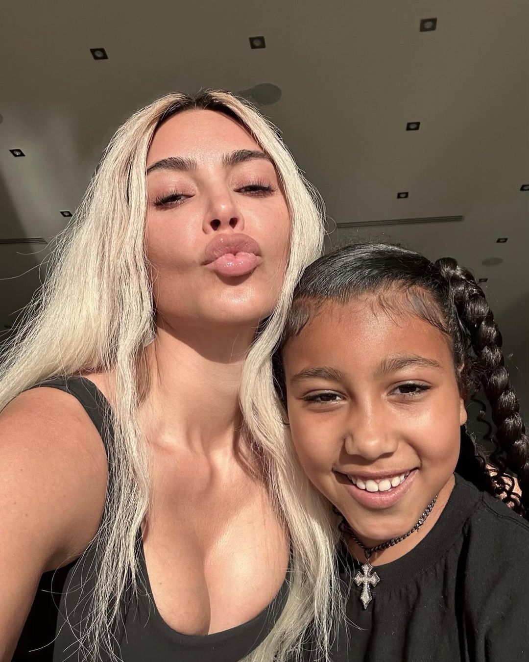 Kim Kardashian reveals completely natural skin including wrinkles and blemishes in new selfie with daughter North, 9