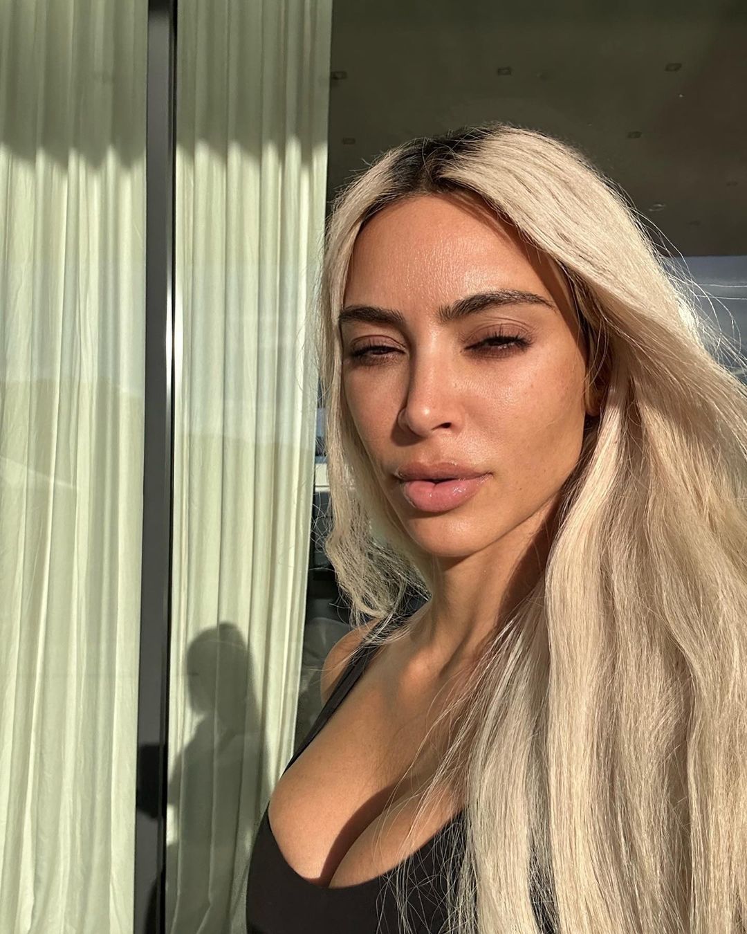 Kim Kardashian reveals completely natural skin including wrinkles and blemishes in new selfie with daughter North, 9