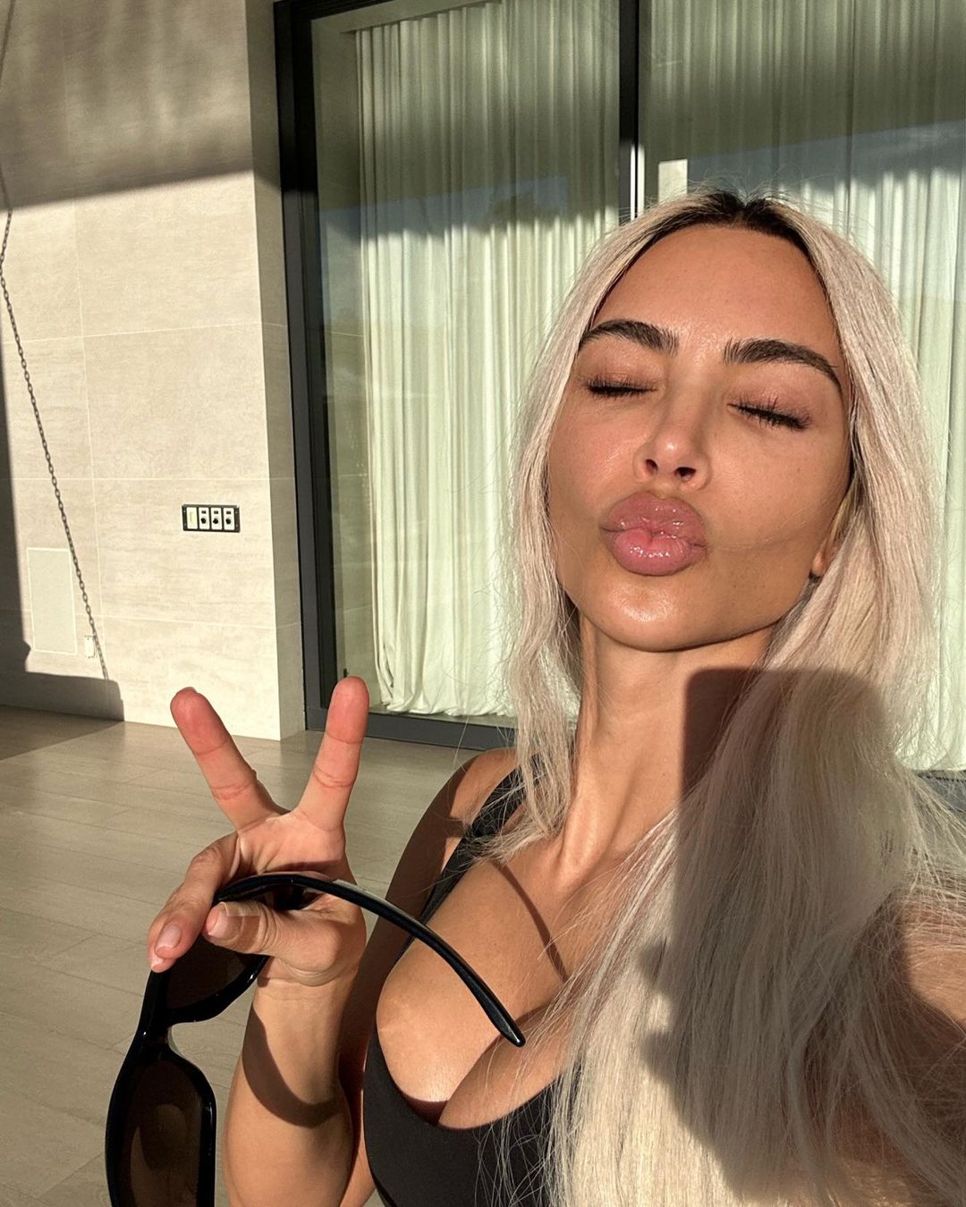 Kim Kardashian reveals completely natural skin including wrinkles and blemishes in new selfie with daughter North, 9