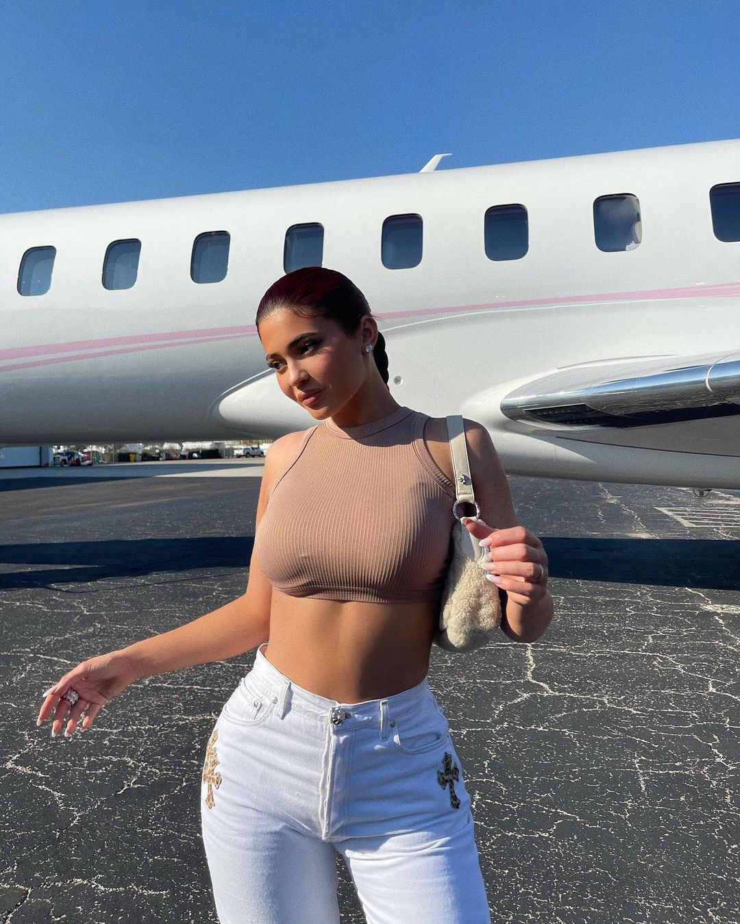 Kylie Jenner and Travis Scott ripped for flying in separate private jets to same location