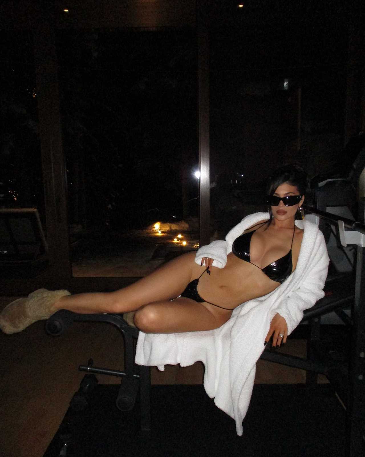 Kylie Jenner nearly slips out of tiny bikini as she relaxes in hot tub for new photos- but fans mock star for pose