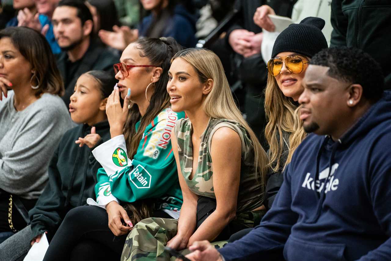 Kim Kardashian shows off her tiny waist in all-camouflage outfit for new photos- but fans blast ‘outdated’ look