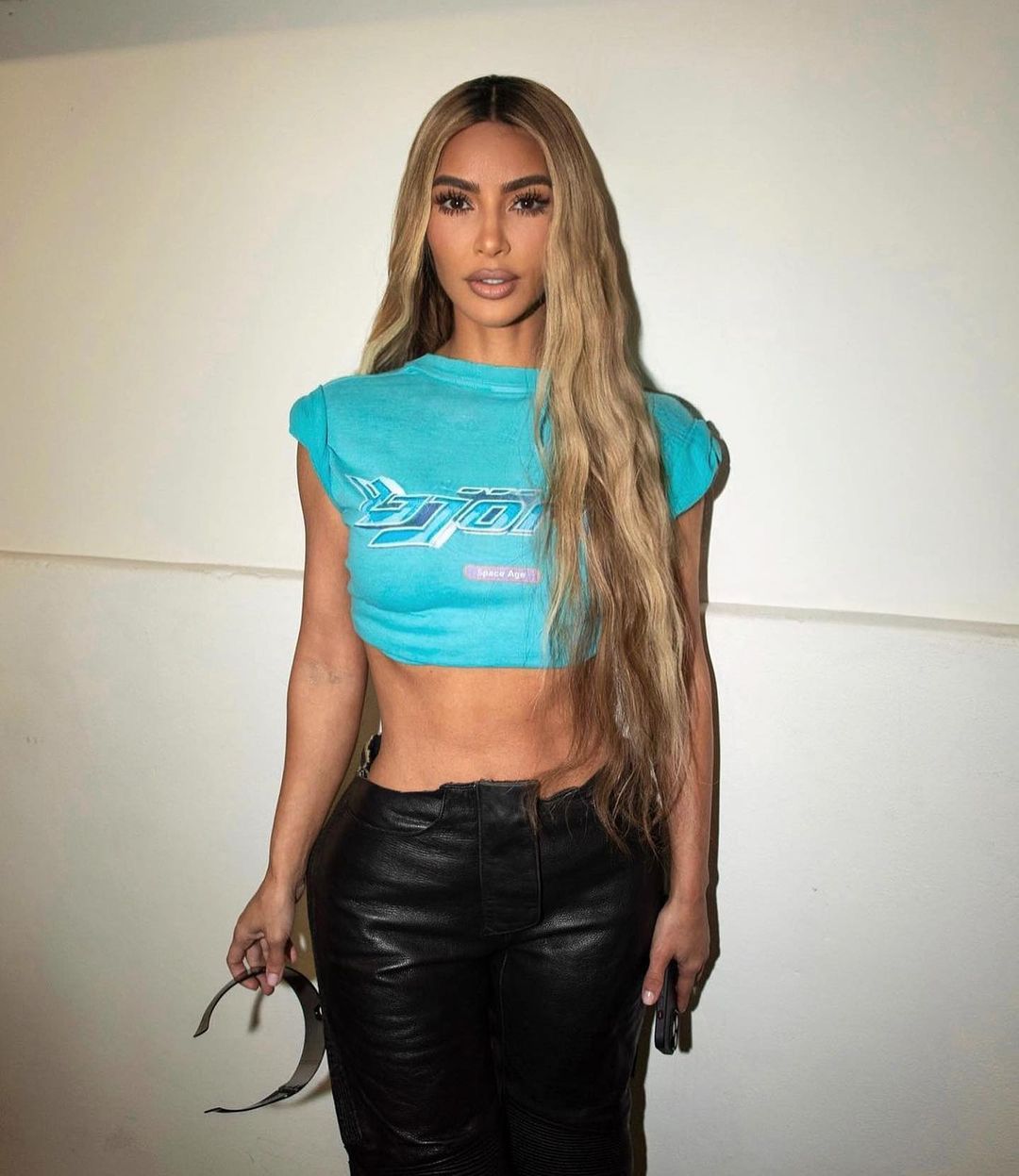 Kim Kardashian shows off her tiny waist in all-camouflage outfit for new photos- but fans blast ‘outdated’ look