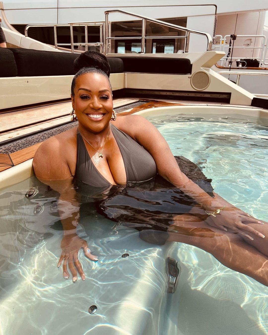 Alison Hammond looks slimmer than ever as she poses in swimsuit on a yacht